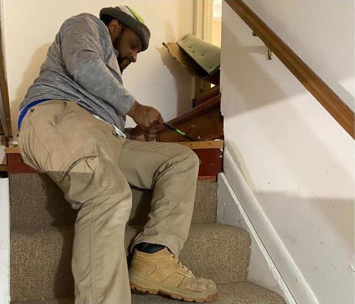 One of our technicians removing the carpet from a staircase in an Albany home.