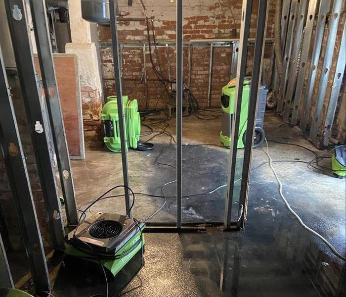 A flooded Albany business with SERVPRO dryers drying it out.